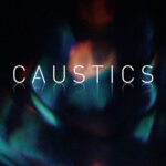 Theme pack “Caustics” featuring light-dappled reflections and abstract motion backgrounds with a modern, organic feel.