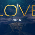"Love Advent" text in gold letters with star of Bethlehem shining above empty manger on deep blue starry night background for church advent video