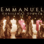 Elegant Christmas mini-movie featuring golden bronze nativity figurines of Mary, Joseph, baby Jesus, wise men, and shepherd arranged before glowing white and pink candles with golden bokeh lights and "Emmanuel Christmas Opener" text in refined serif typography