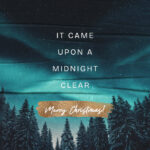Serene Christmas social media graphic featuring snowy evergreen forest silhouettes under starry teal aurora borealis sky with white text "It Came Upon A Midnight Clear" and gold brushstroke accent reading "Merry Christmas"