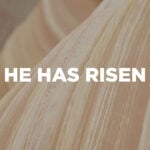 "He Has Risen" Easter mini-movie title graphic with bold white sans-serif typography centered over a soft, warmly lit close-up of flowing natural wood grain fabric in creamy linen tones — evoking the burial cloths left behind in the empty tomb.